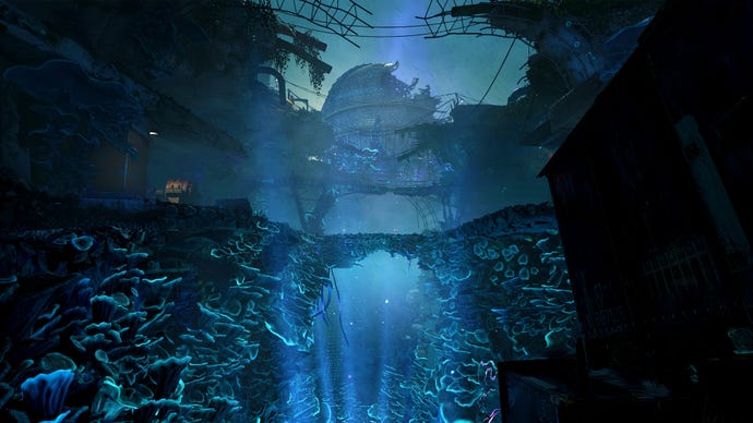 A chasm full of glowing blue fungus below a wrecked dome in Atomfall